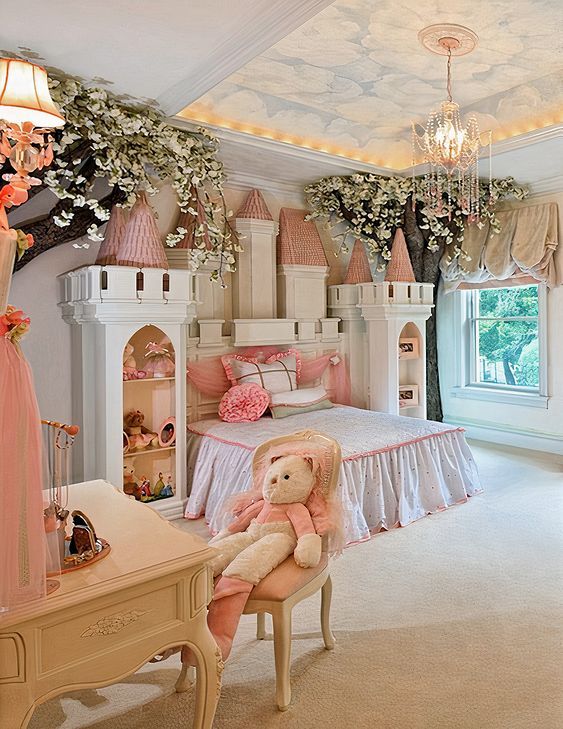 A whimsical bedroom designed like a fairy tale castle, featuring a bed with castle-inspired towers and a canopy. Soft pink and white decor elements create a dreamy ambiance, with a plush teddy bear sitting on a chair in the foreground.